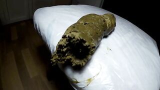 Woman spreads her ass cheeks over a huge turd.