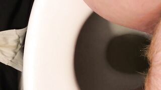 Woman spreads her ass and shits in a toilet