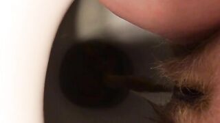 Woman spreads her ass and shits in a toilet