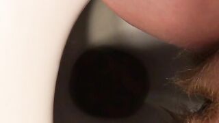 Woman spreads her ass and shits in a toilet