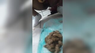 Woman shits in a bathtub full of water