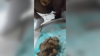 Woman shits in a bathtub full of water