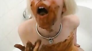 Blond girl plays with her own shit in the bathtub