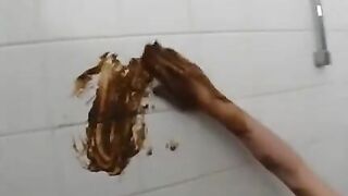 Blond girl plays with her own shit in the bathtub