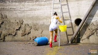 Babe wades in a pit of shit and piss