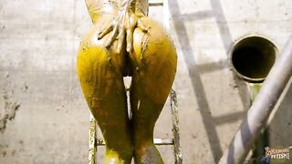 Babe wades in a pit of shit and piss