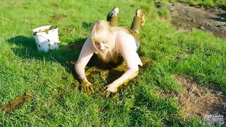 Playing with cow shit in the cow pasture