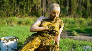 Playing with cow shit in the cow pasture