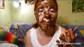 Woman eats shit out of a cake