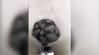 Girl squats and drops a huge shit in a toilet