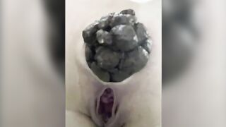 Girl squats and drops a huge shit in a toilet