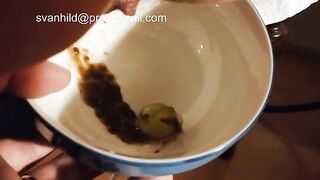 Girl holds a bowl of shit and balls
