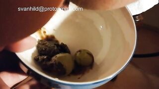 Girl holds a bowl of shit and balls