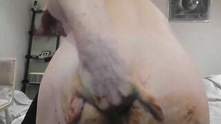 Girl spreads her ass cheeks apart while shit oozes out
