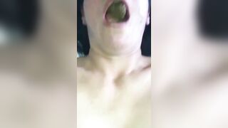 Woman pulls out a big green turd from her ass