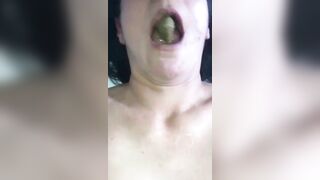 Woman pulls out a big green turd from her ass