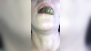 Woman pulls out a big green turd from her ass