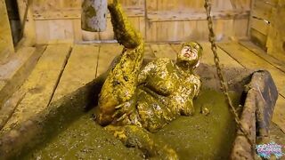 Girl lays in a pile of shit in a wooden room