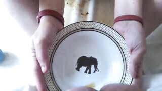 Girl in fetish collar eats a big plate of shit