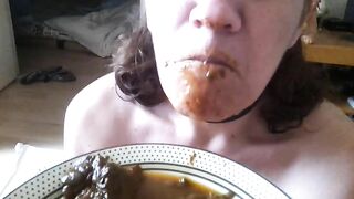 Girl in fetish collar eats a big plate of shit