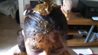 Woman smears her body with her own shit