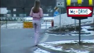 Girl pisses on the side of the road in front of traffic