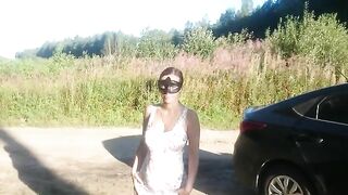 Woman covered in mud and shit outdoors