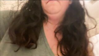 Woman sits on the toilet, letting her shit fill the bowl