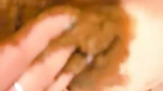 Woman digs around in her own shit