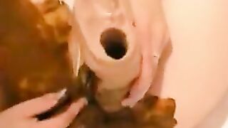 Woman digs around in her own shit