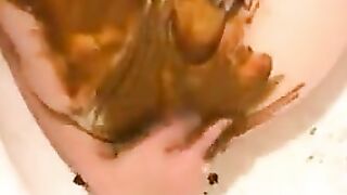 Woman digs around in her own shit