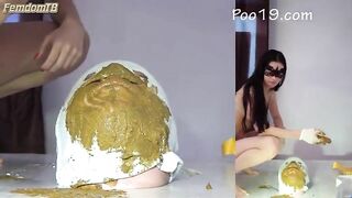 Woman sits on a huge pile of fresh warm shit while wearing a diaper