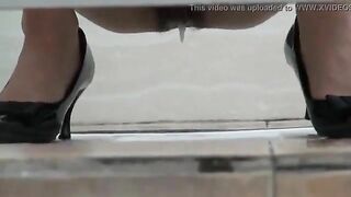 Woman shits and pisses in public toilet