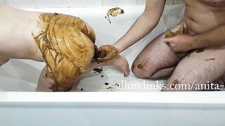 Woman takes a huge shit in the bathtub with a man