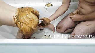 Woman takes a huge shit in the bathtub with a man