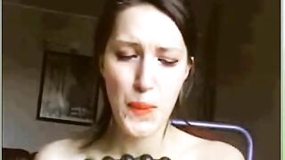 Woman eats shit off a dildo with beads