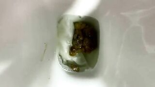Woman pushes a big shit out of her ass