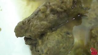 Girl in uniform takes a huge shit and pisses herself