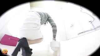 Woman in striped shirt takes a massive shit on the toilet