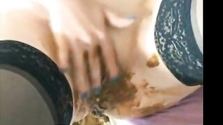 Woman takes a huge shit on the couch and rubs it on her belly