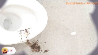 Girl in school uniform sits on the toilet to take a huge shit