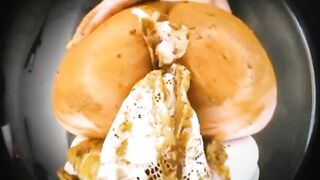 Woman uses her ass to play with shit on a plate