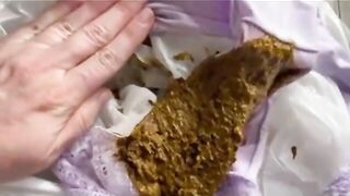 Girl plays with huge wet shit in her hand