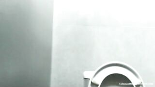 Woman spreads her ass to take a shit on the toilet
