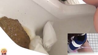 Girl in uniform takes a huge shit on the toilet