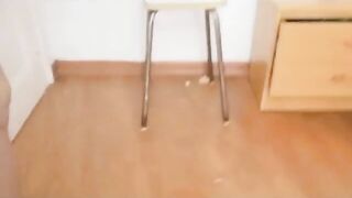 Girl in uniform squats while shitting on the floor