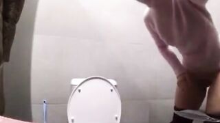 Woman shits on the toilet and wipes with a shoe