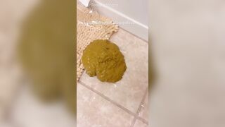 Woman with rainbow underwear takes a huge shit on the bathtub