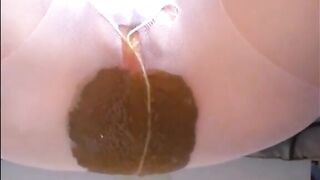 Woman shits diarrhea on white pantyhose