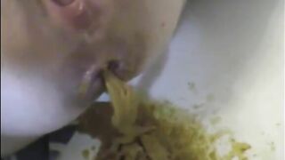 Girl spreads her ass and drops a huge shit on the floor